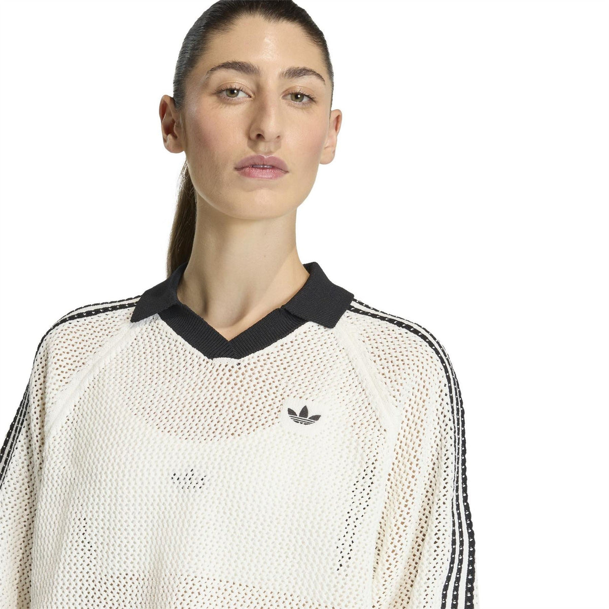Off-white knit polo shirt close-up with black collar and trefoil logo