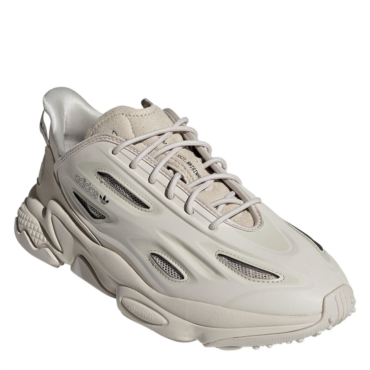 adidas Originals Ozweego Celox sneakers in grey with white accents, showcasing the sporty footwear design and textured sole.