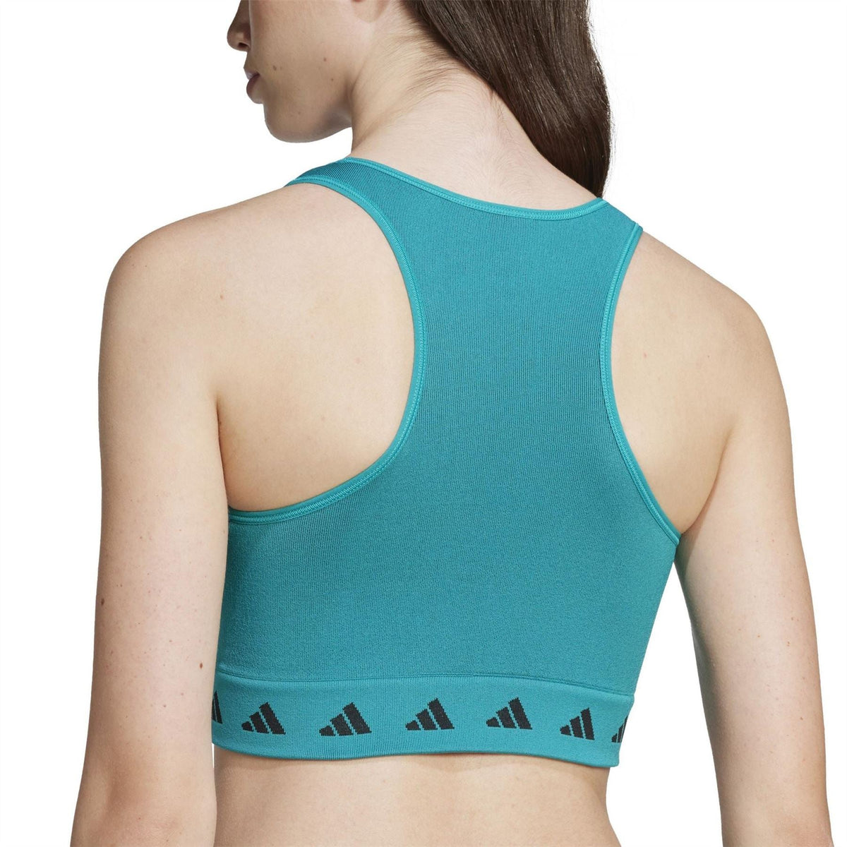 Teal cropped racerback tank with patterned hem band; back view over shoulder