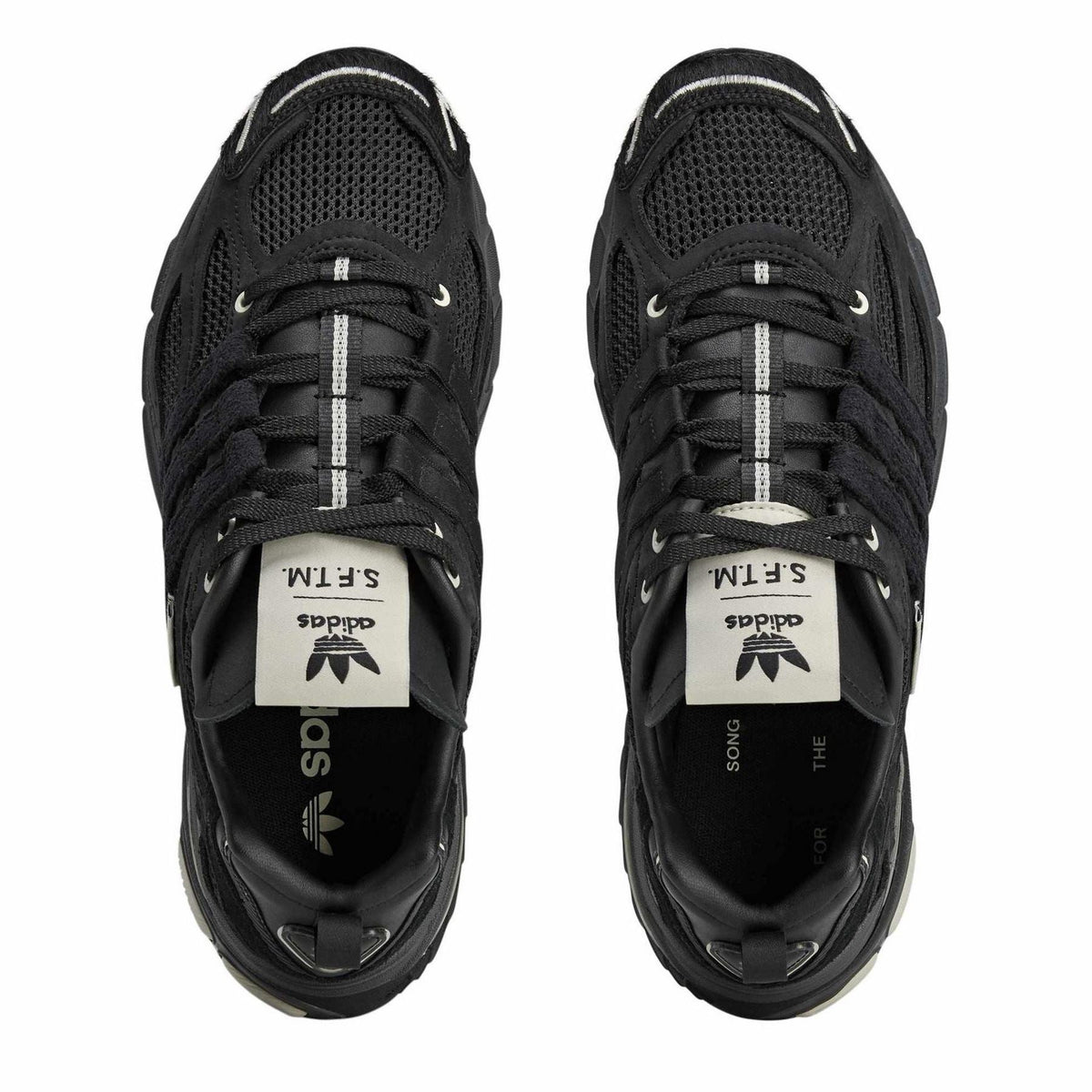 adidas Originals Cushion STFM trainers in black and white with cushioned midsole and sporty design, perfect for casual wear.