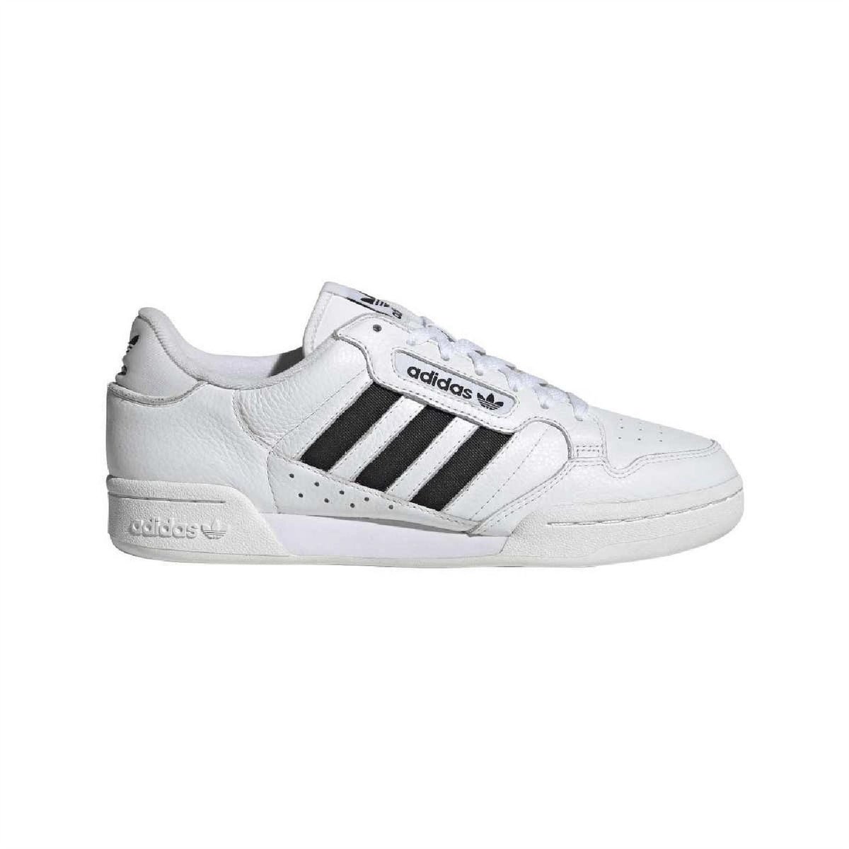 White adidas low-top trainers with black three stripes and lace-up front