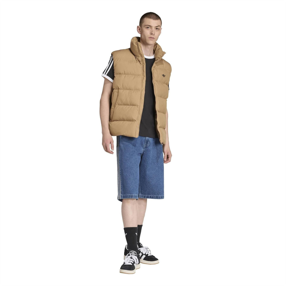 Tan sleeveless puffer vest with quilted front panels and stand collar