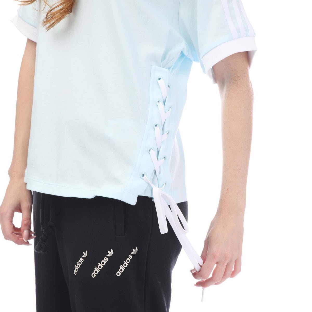 Light blue T-shirt with side lace-up ribbon ties at hem, short sleeves