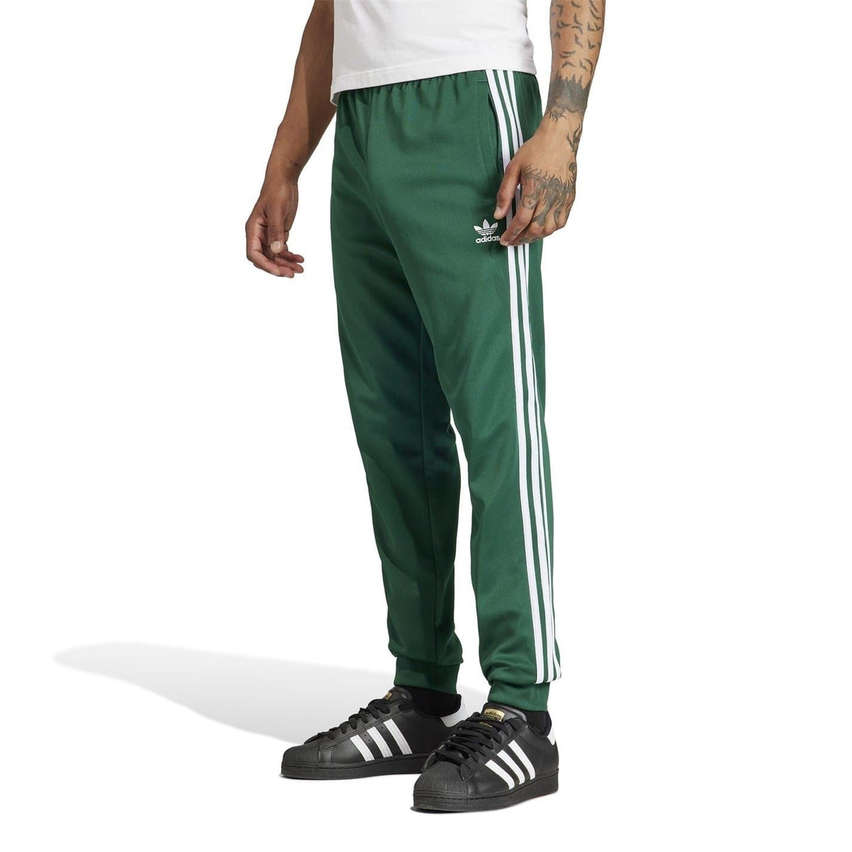 Green slim track pants with contrast side stripes and ankle-length tapered legs