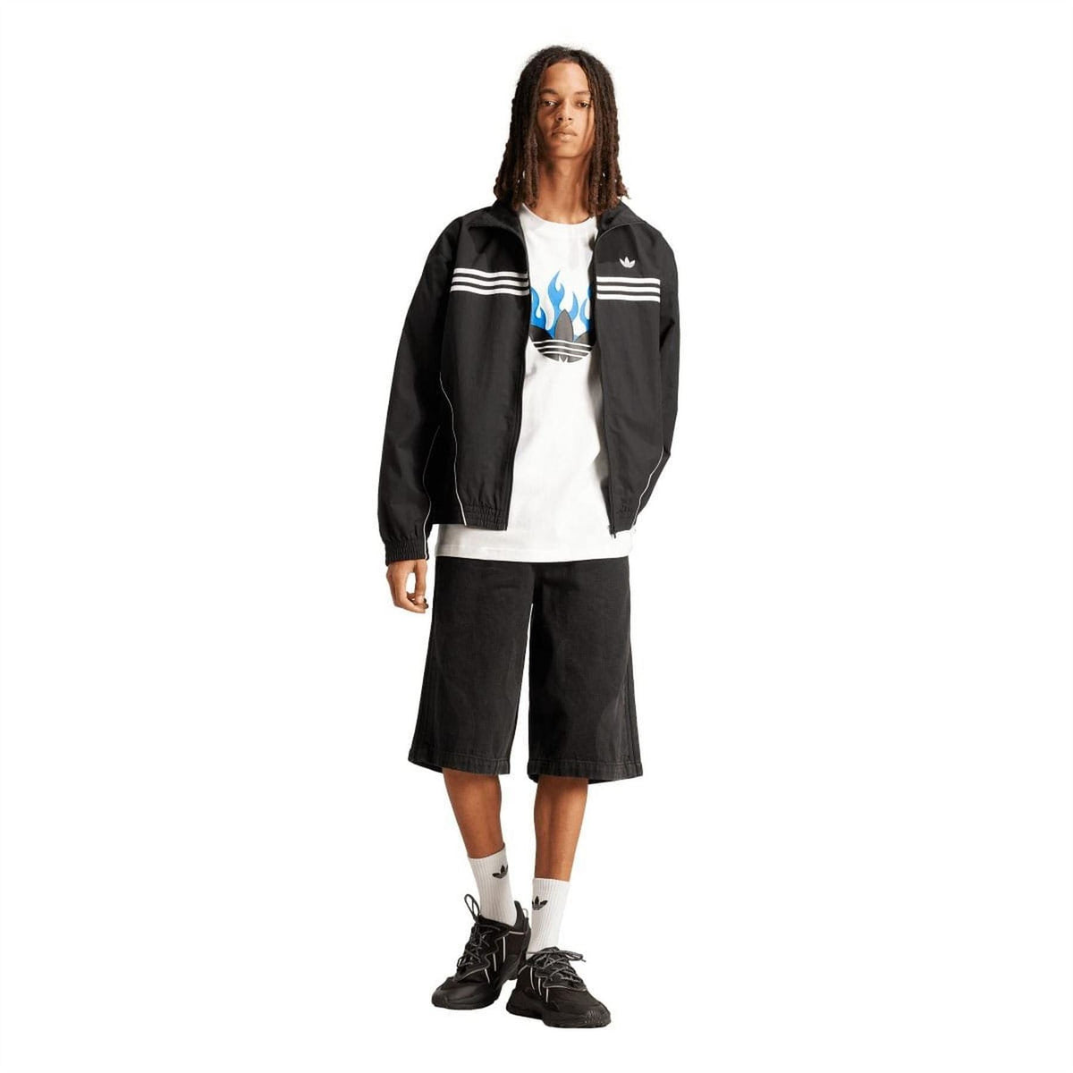White T-shirt with blue flame logo peeking under a black jacket, short sleeves