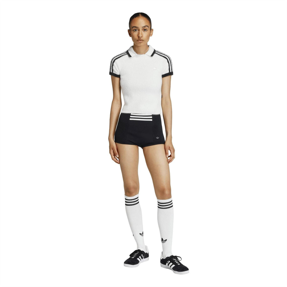 adidas Originals womens white polo shirt front view with black stripe detailing