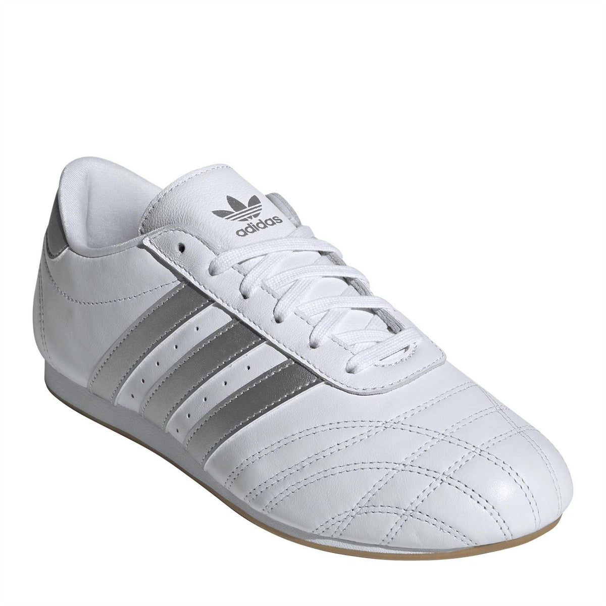 adidas Originals Taekwo low top sneakers in white with black accents, showcasing the stylish footwear design and branding details