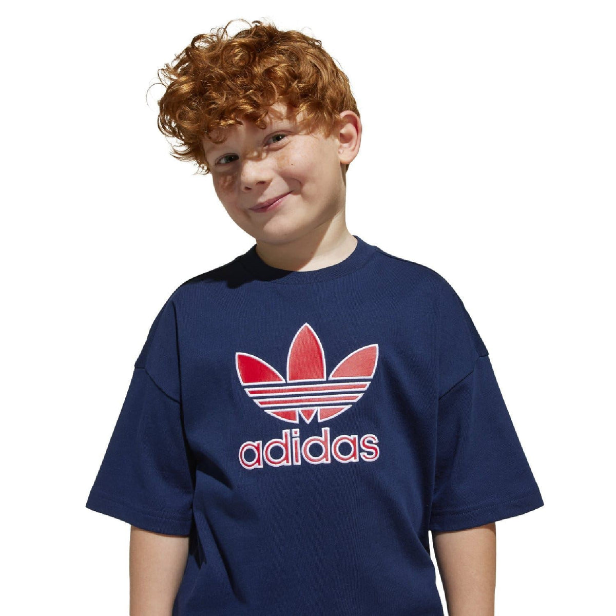 Kids navy adidas T-shirt with large red trefoil logo on the chest