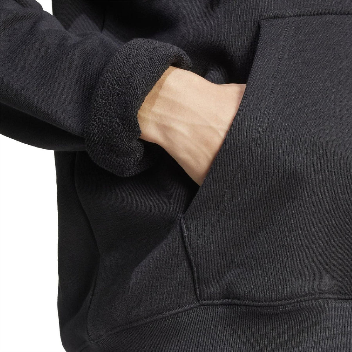 Black hoodie fabric with ribbed cuff and stitched pocket seam detail