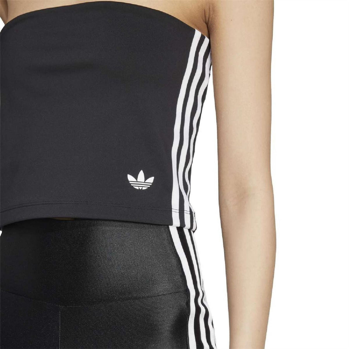 Close-up of black strapless tube top with white vertical 3-stripe panel and Trefoil logo