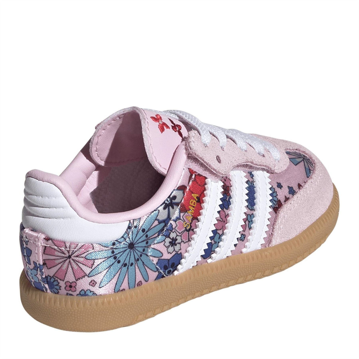 Pink and white low-top sneaker with patterned collar lining, lace-up front, gum outsole.