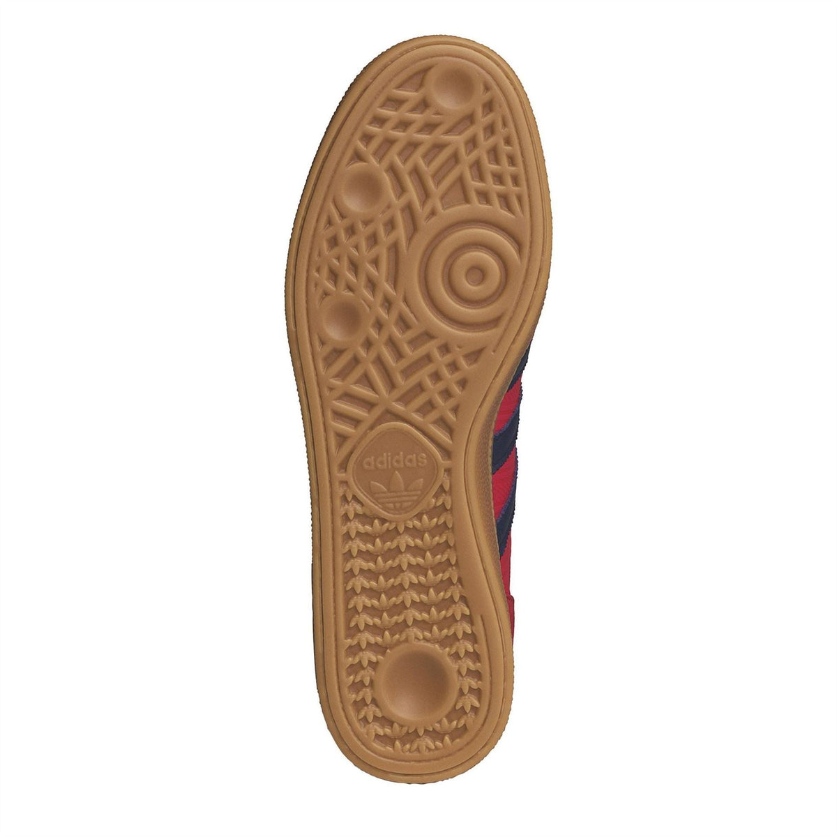 Gum outsole bottom view of a low-top adidas trainer with textured tread