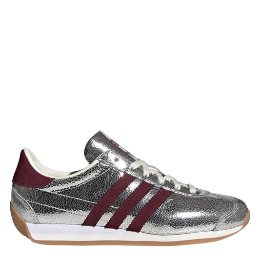 Adidas Originals Country OG TR footwear featuring classic design, white and green colorway, and sporty lace-up style.