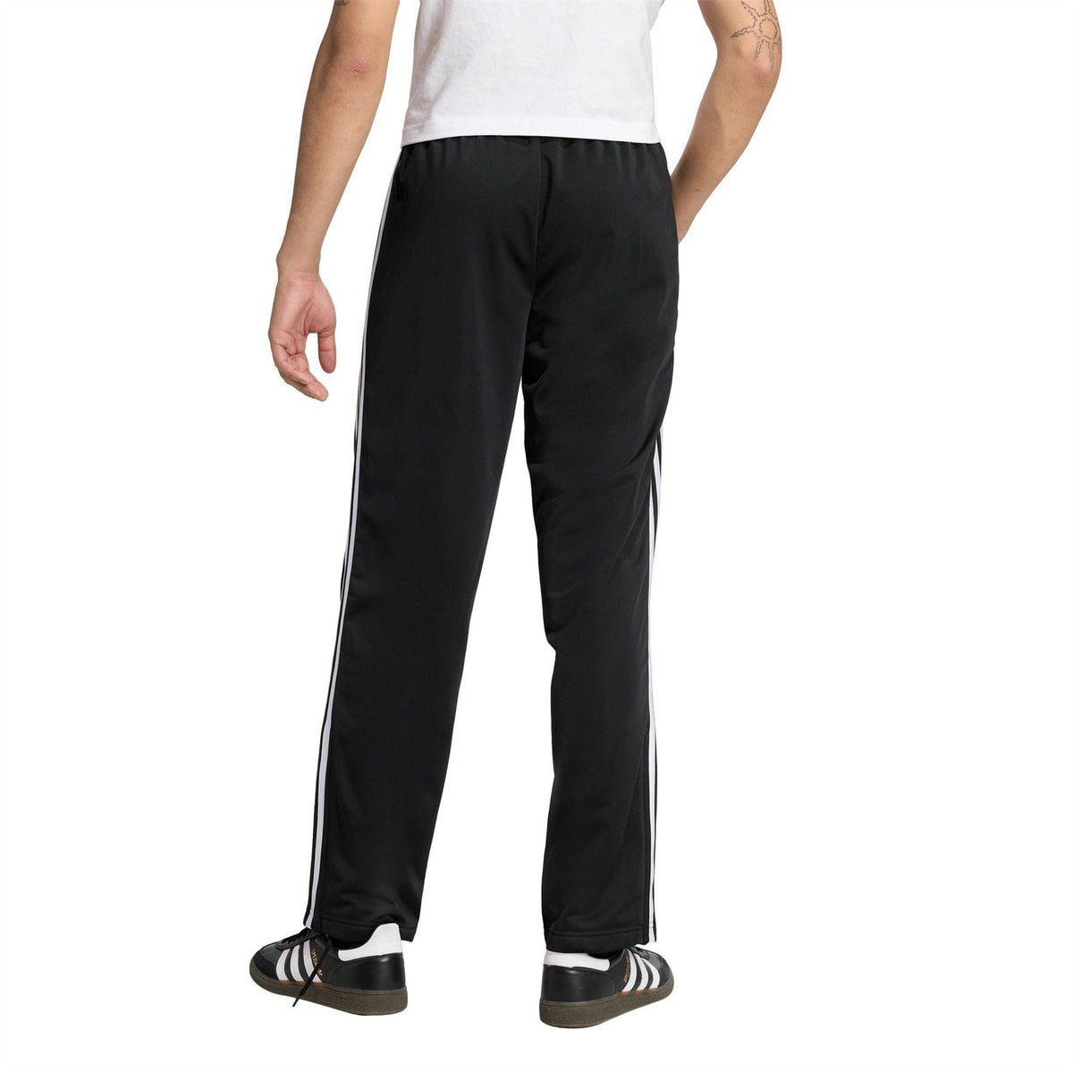 adidas men's woven track joggers in black, tapered legs with white side stripes