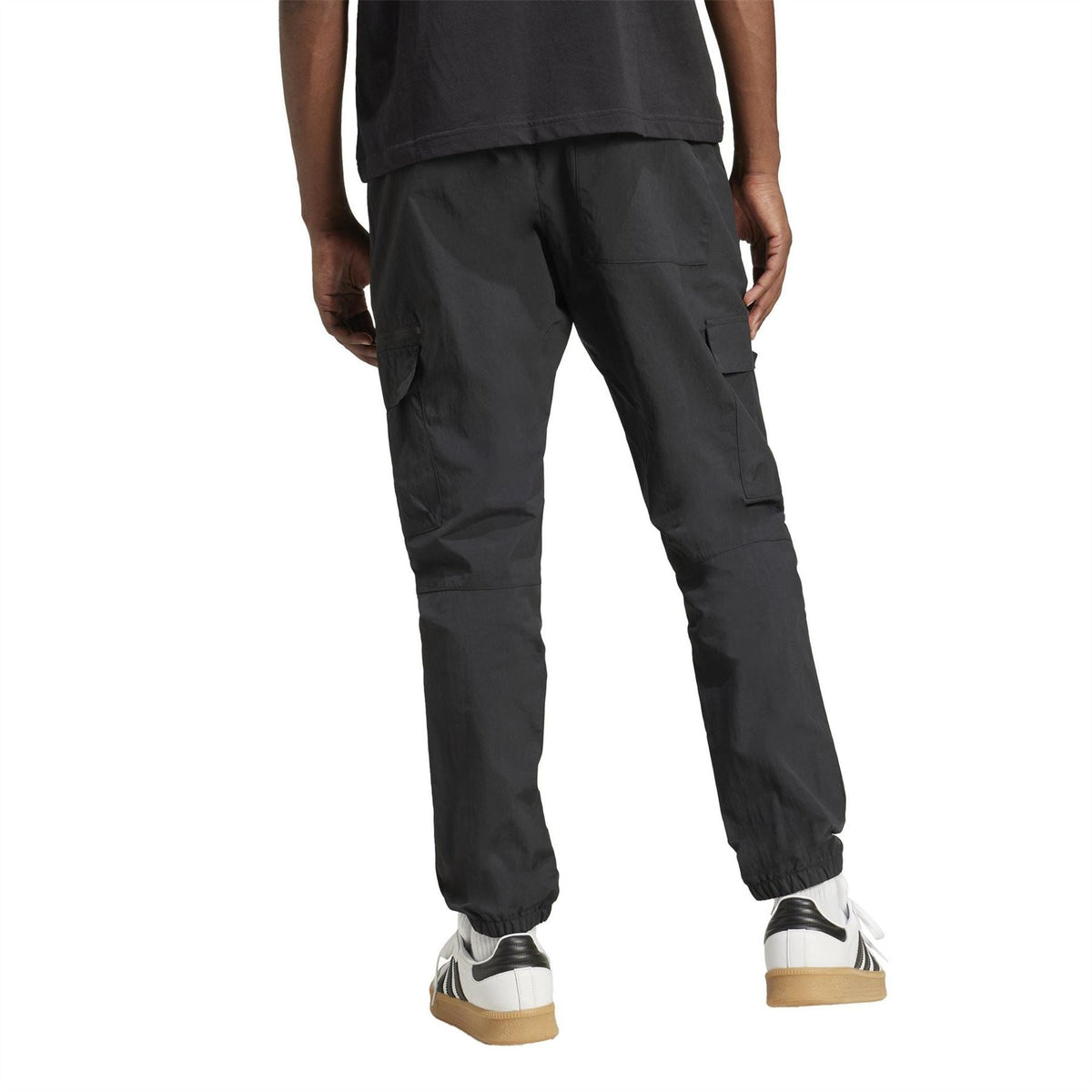 Black cargo pants with relaxed fit, tapered legs, and side cargo pockets