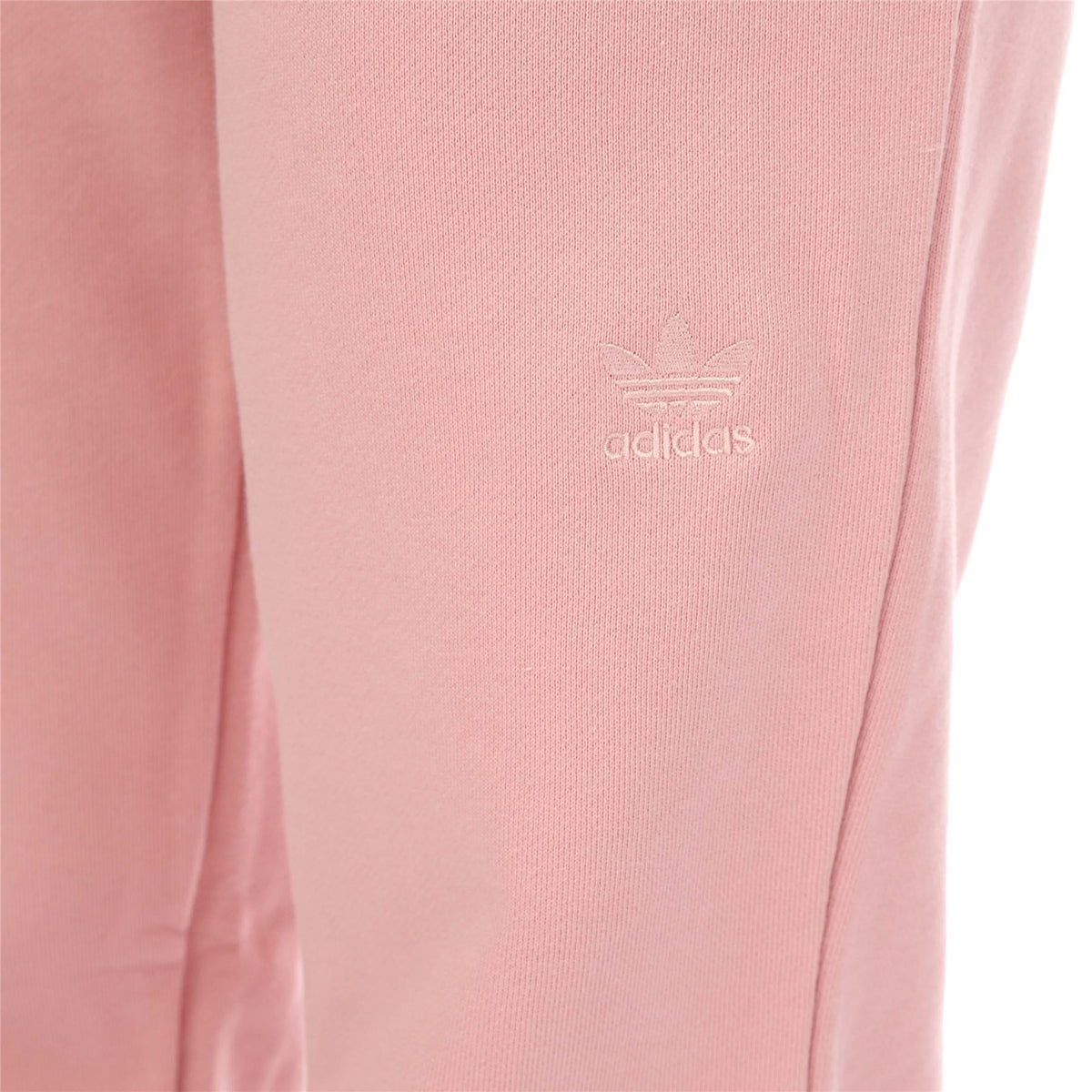 Pink joggers with adidas trefoil logo on thigh