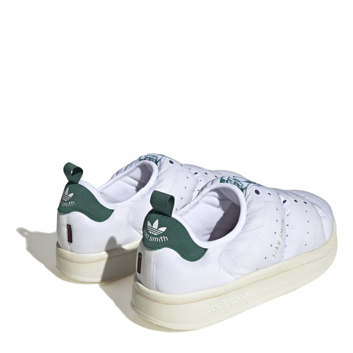adidas Originals Puffy Spr trainers with classic three stripes, showcasing a sporty, cushioned footwear design in black and white.
