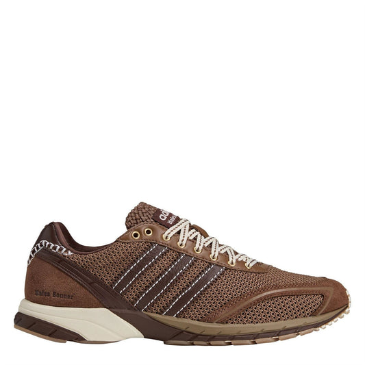 Brown mesh running shoes with striped panels, white laces, and cream midsole.