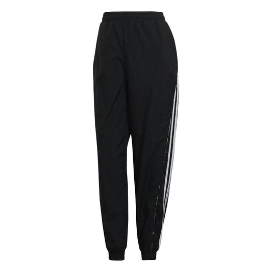 Black track-style sweatpants with side stripe panels and ribbed ankle cuffs