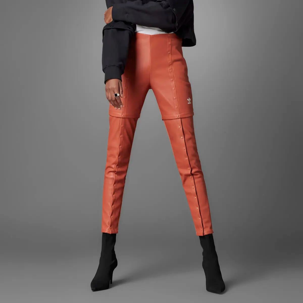 Black adidas Originals Slim Pant trousers with a tapered fit, featuring the iconic adidas logo on the waistband.