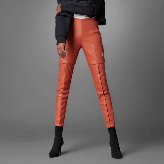 Black adidas Originals Slim Pant trousers with a tapered fit, featuring the iconic adidas logo on the waistband.