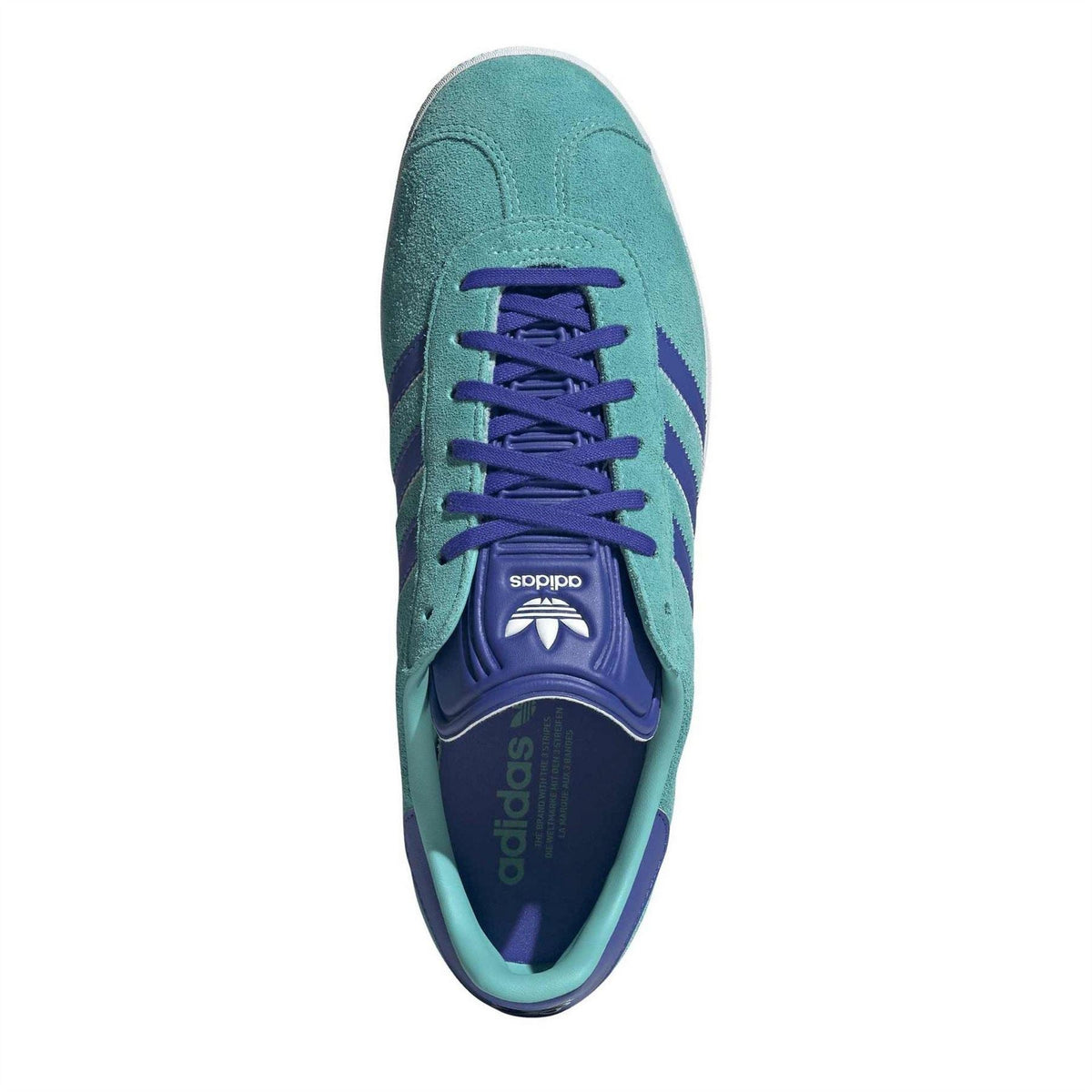 adidas Gazelle suede trainers, top view: teal upper with purple laces and adidas tongue