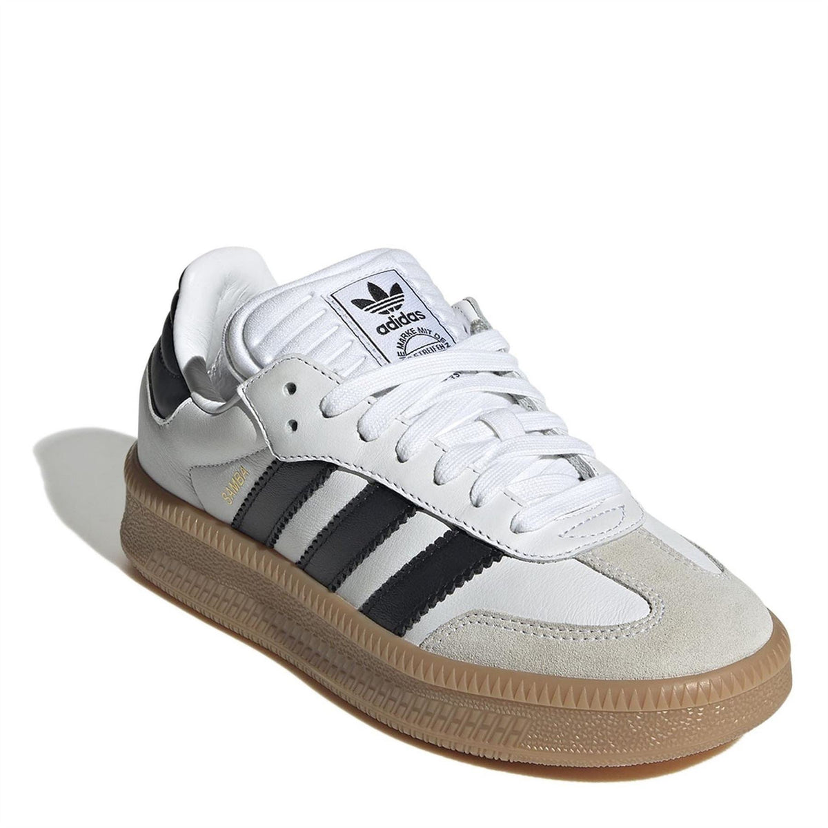 Kids white lace-up sneakers with black stripes and tan gum outsole