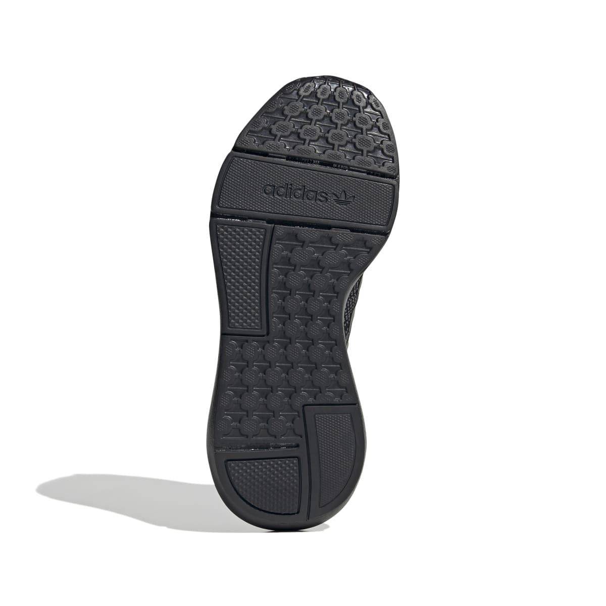 Kids' adidas trainer outsole with textured tread and logo mark