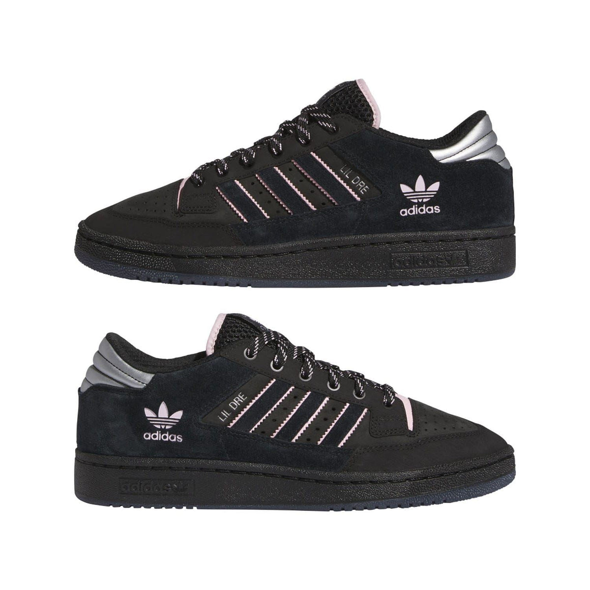 Pair of black low-top trainers with pink accents, stripe logo, and lace-up design