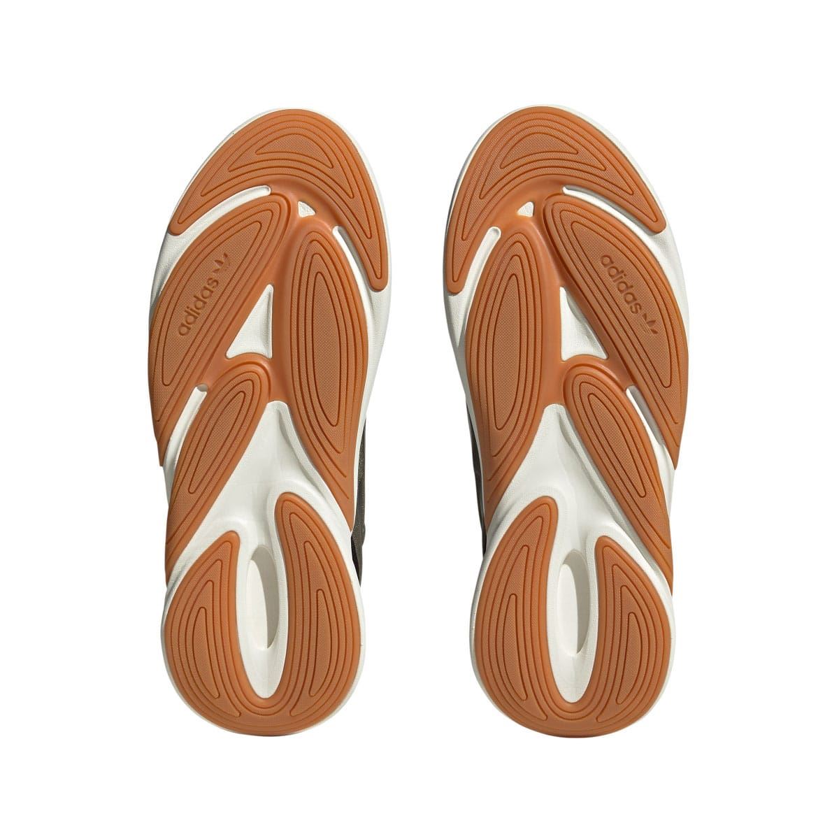 Shoe outsoles with orange-brown tread and white base, shown from underneath