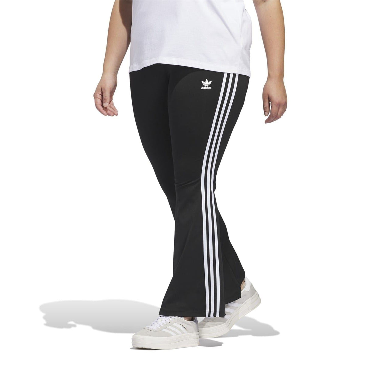 adidas Originals flared leggings for fitness and gymwear, shown in black with a high-waist design and athletic fit