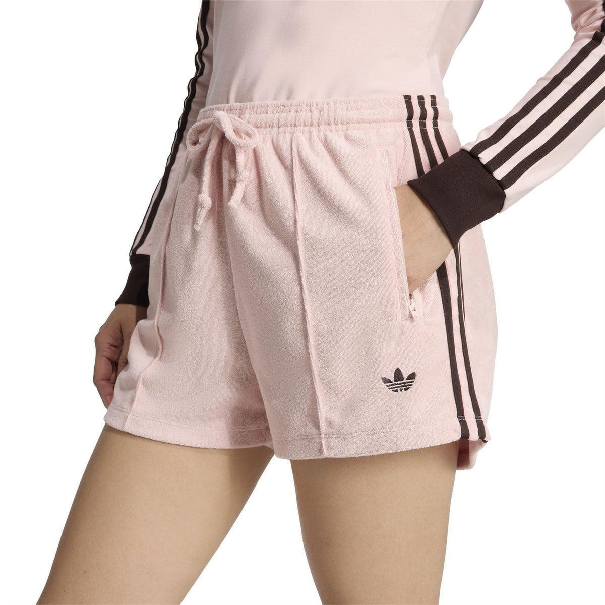Sandy pink terry towel shorts with drawstring tie and black side stripe trim