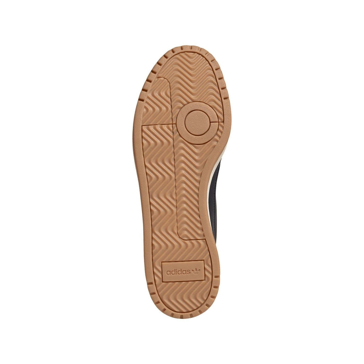 Shoe outsole view with textured tan rubber tread and adidas label