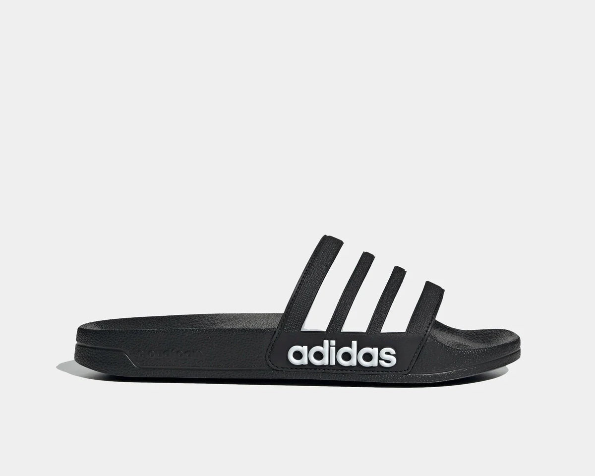 Black shower slide sandals with adidas logo and three white stripes on the strap