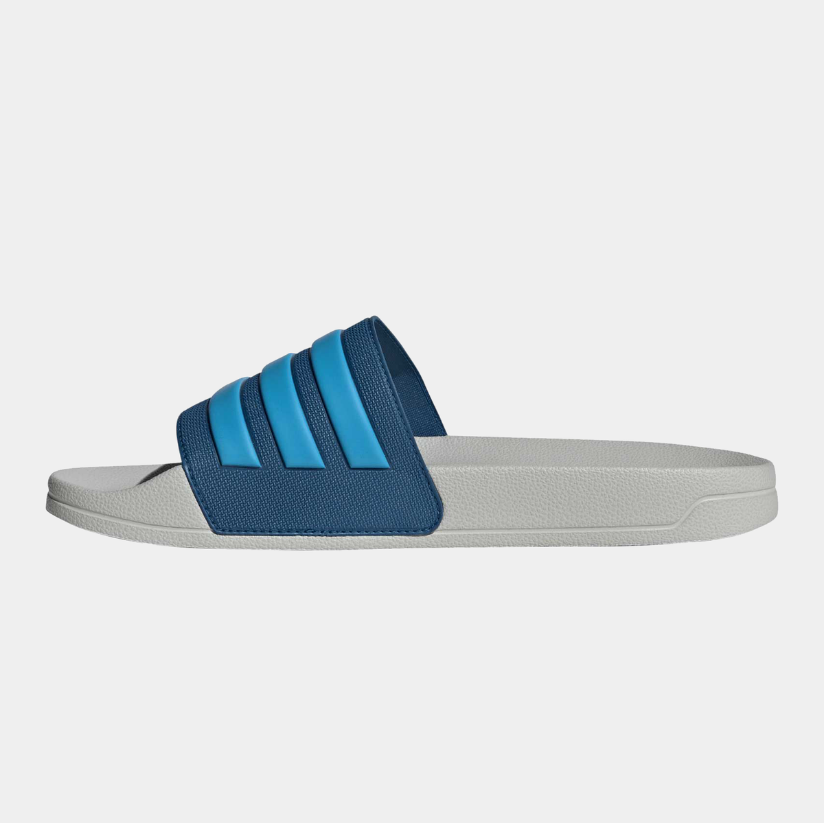Adilette shower slides front-left angle, blue three-strap upper on light gray base