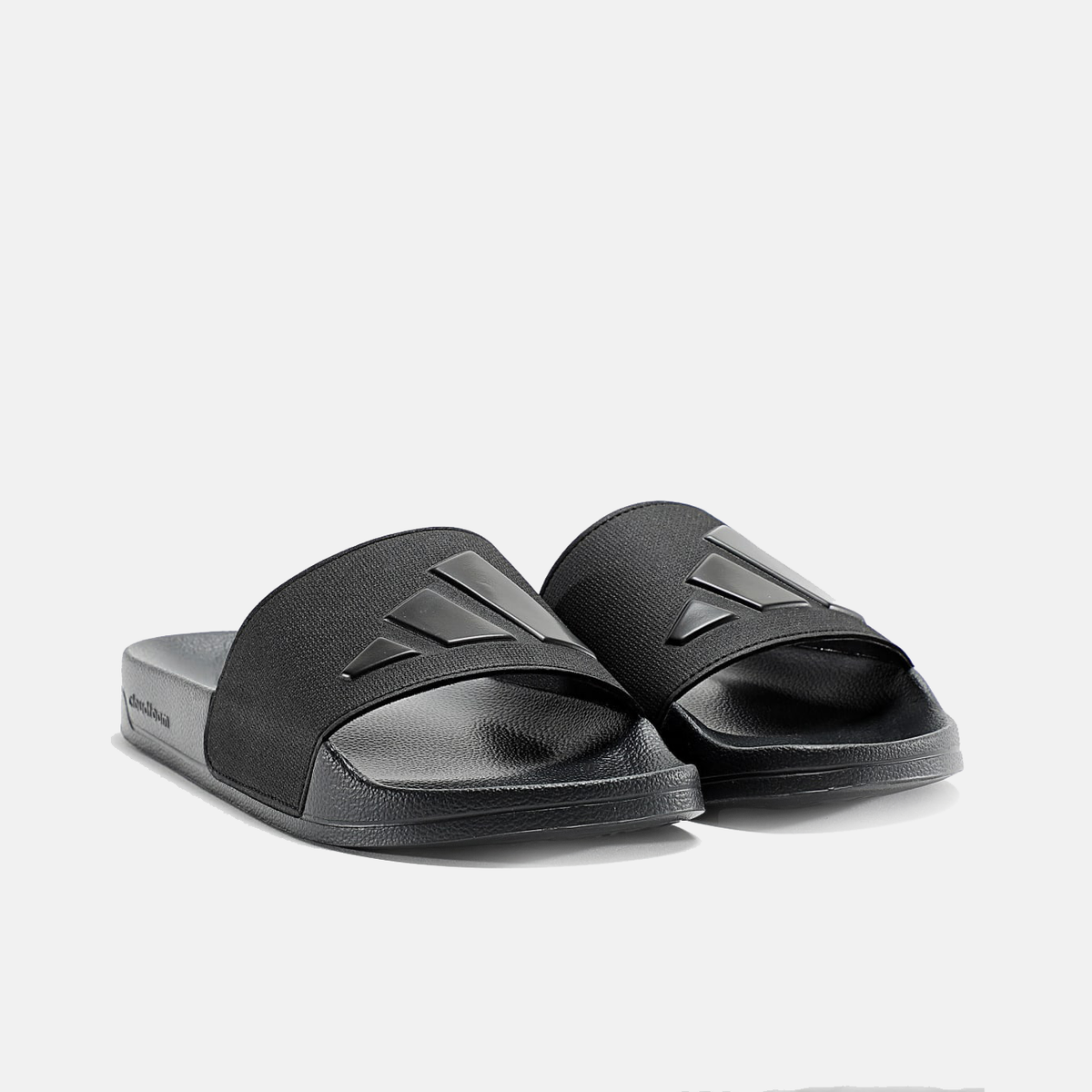 Pair of black adidas slide sandals with textured straps and open toe