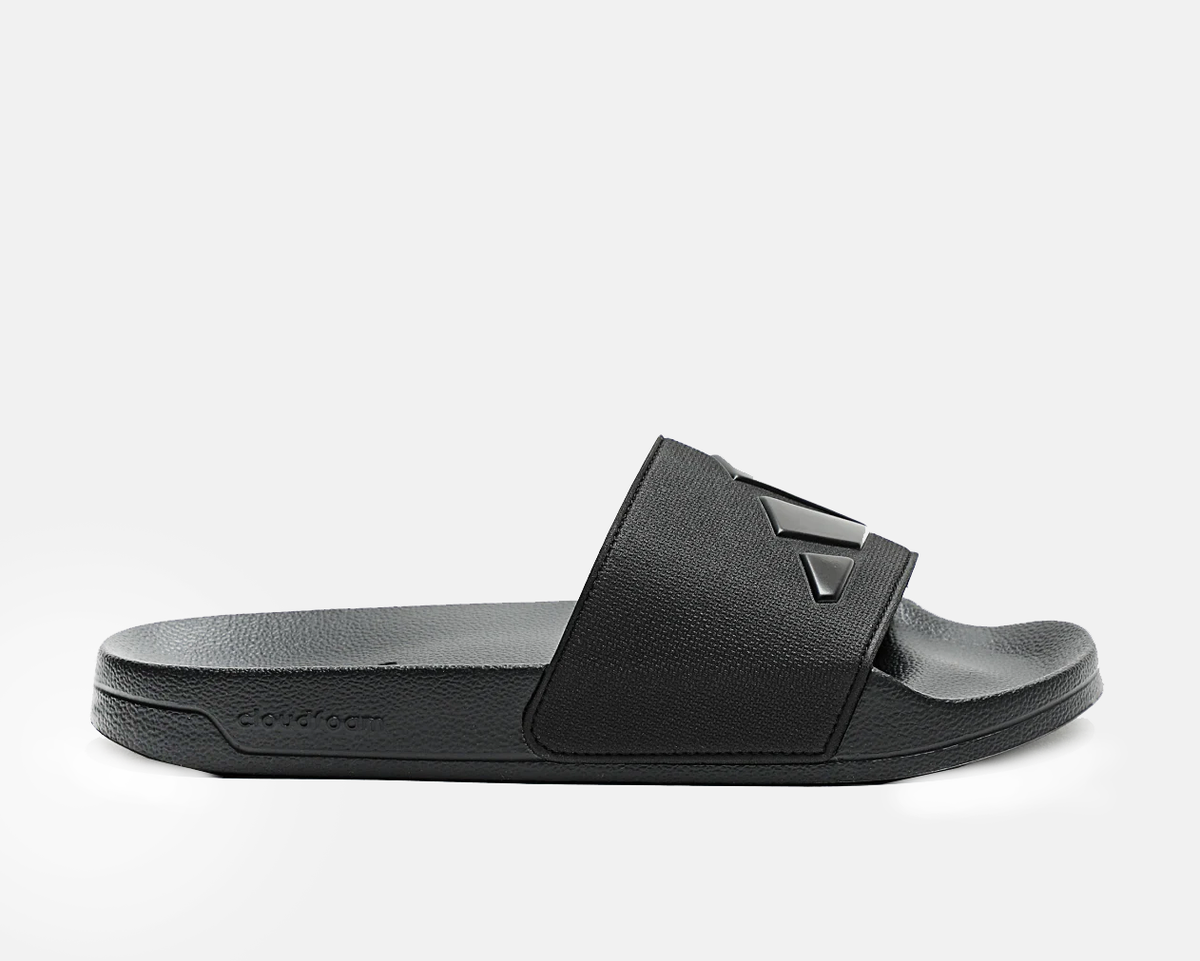 Black slide sandals with wide strap and adidas logo on footbed