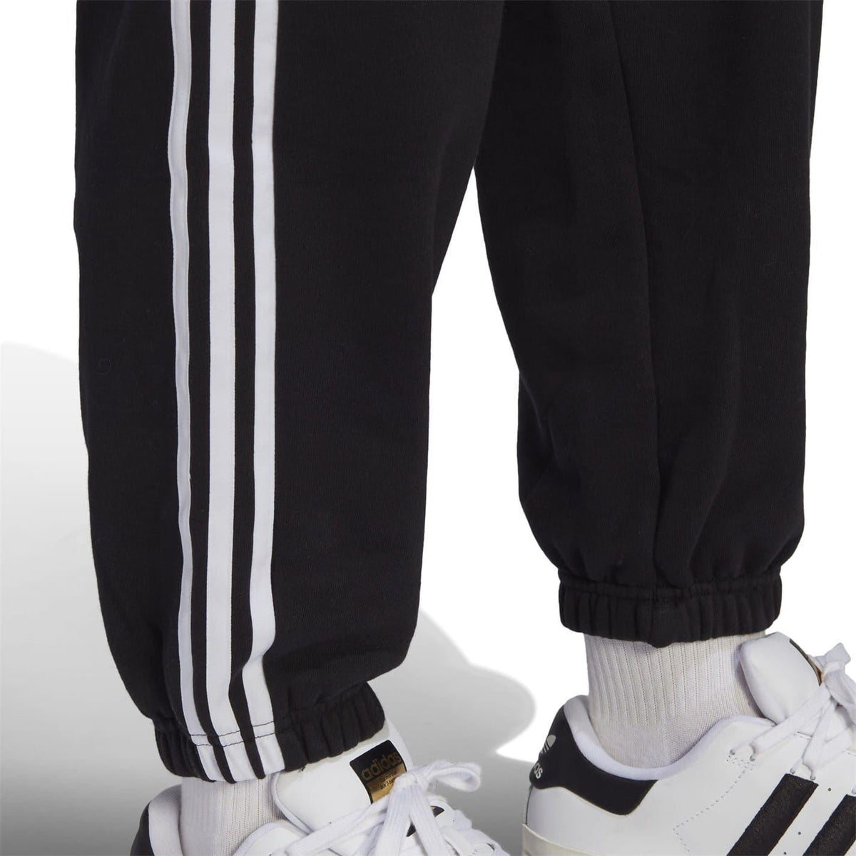 adidas Originals relaxed joggers, stylish track pants with tapered fit and elastic cuffs, made from comfortable fabric.