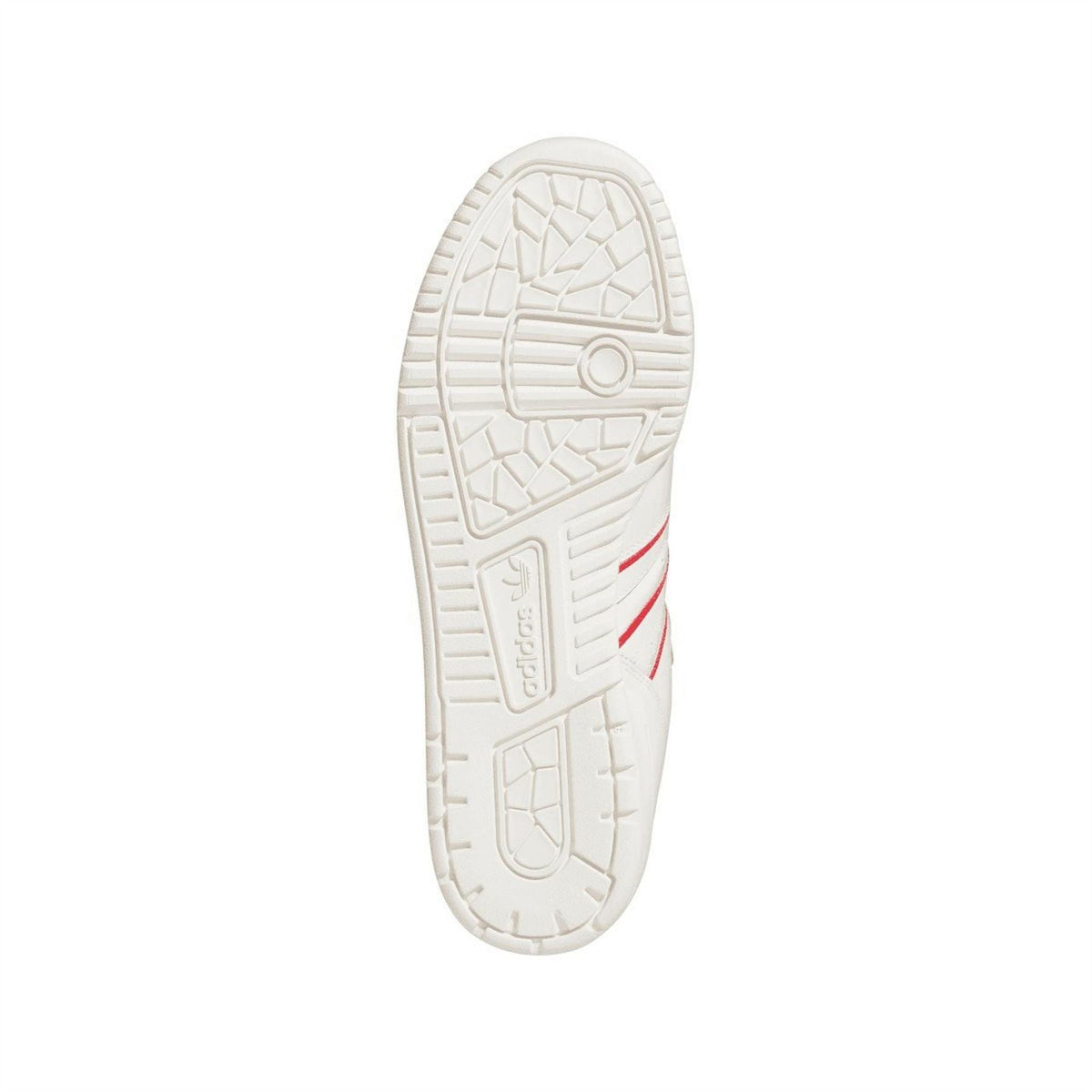 White outsole for low-top trainers with patterned tread and adidas logo.