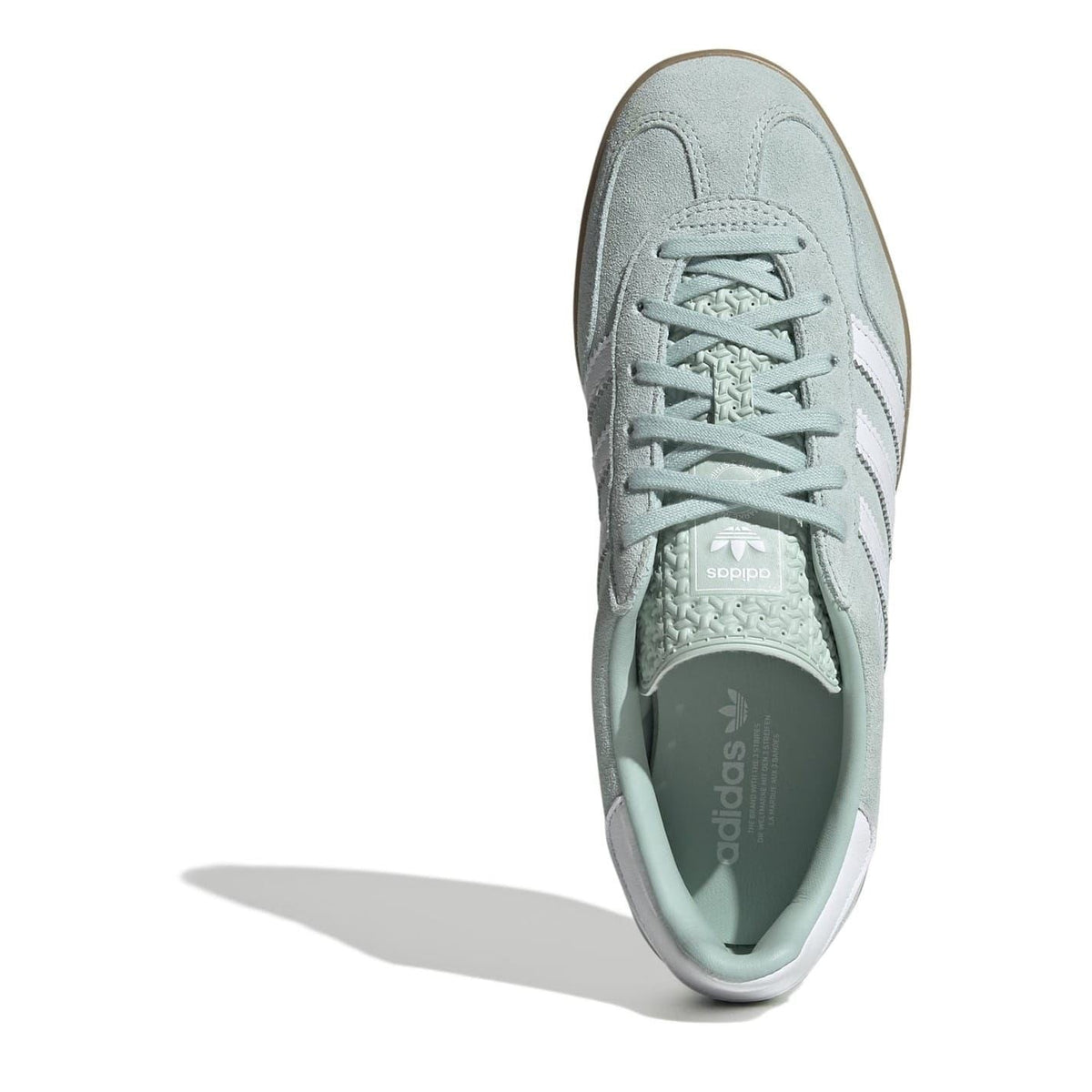 Top view of light aqua suede lace-up trainers with adidas logo on tongue.