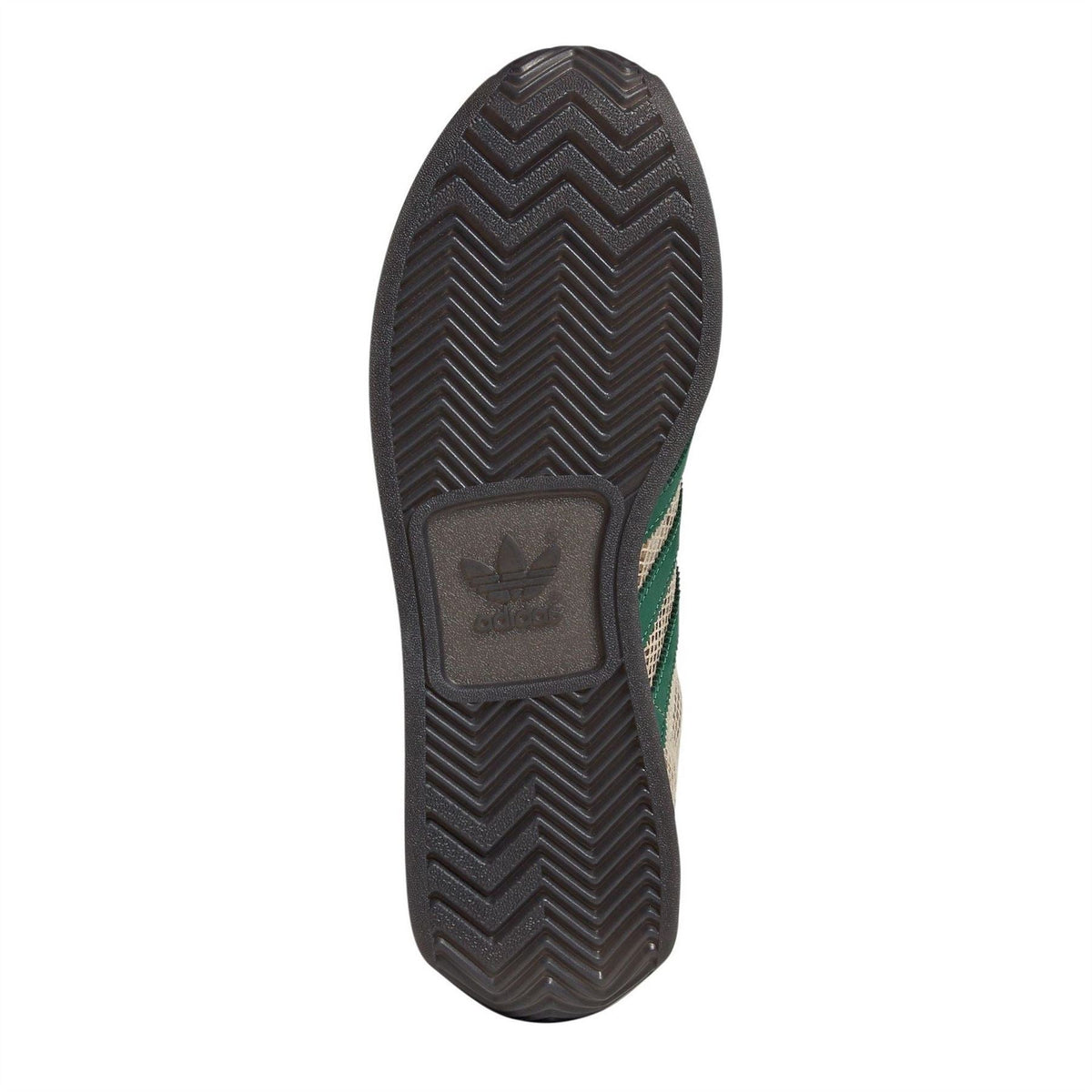 adidas Originals sneaker outsole with zigzag tread and green logo patch