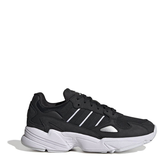 Black low-top lace-up sneakers with white 3-stripe detail and white chunky sole