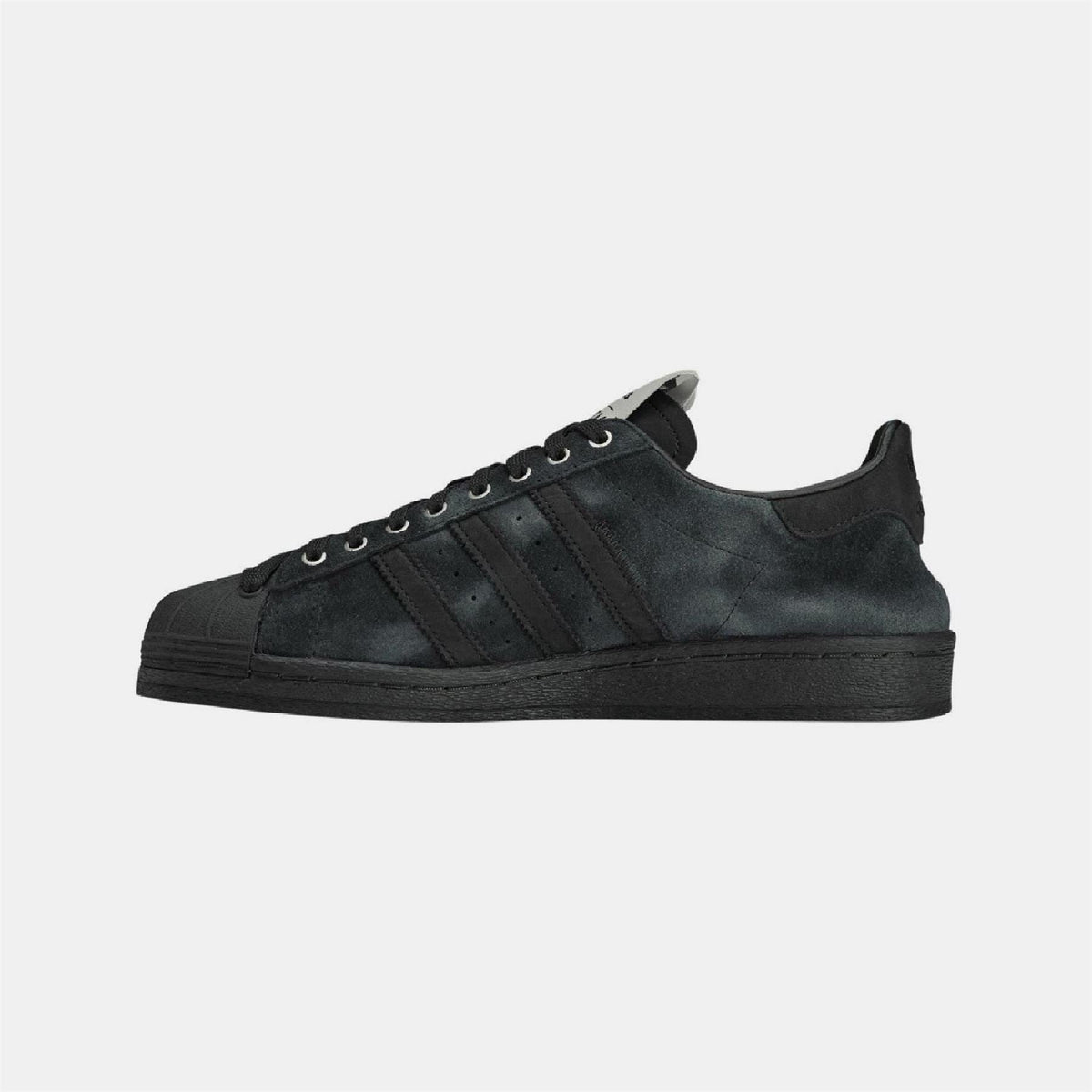 adidas Originals Superstar 82 trainers, classic white footwear with signature shell toe and rubber sole, displayed on a neutral background.