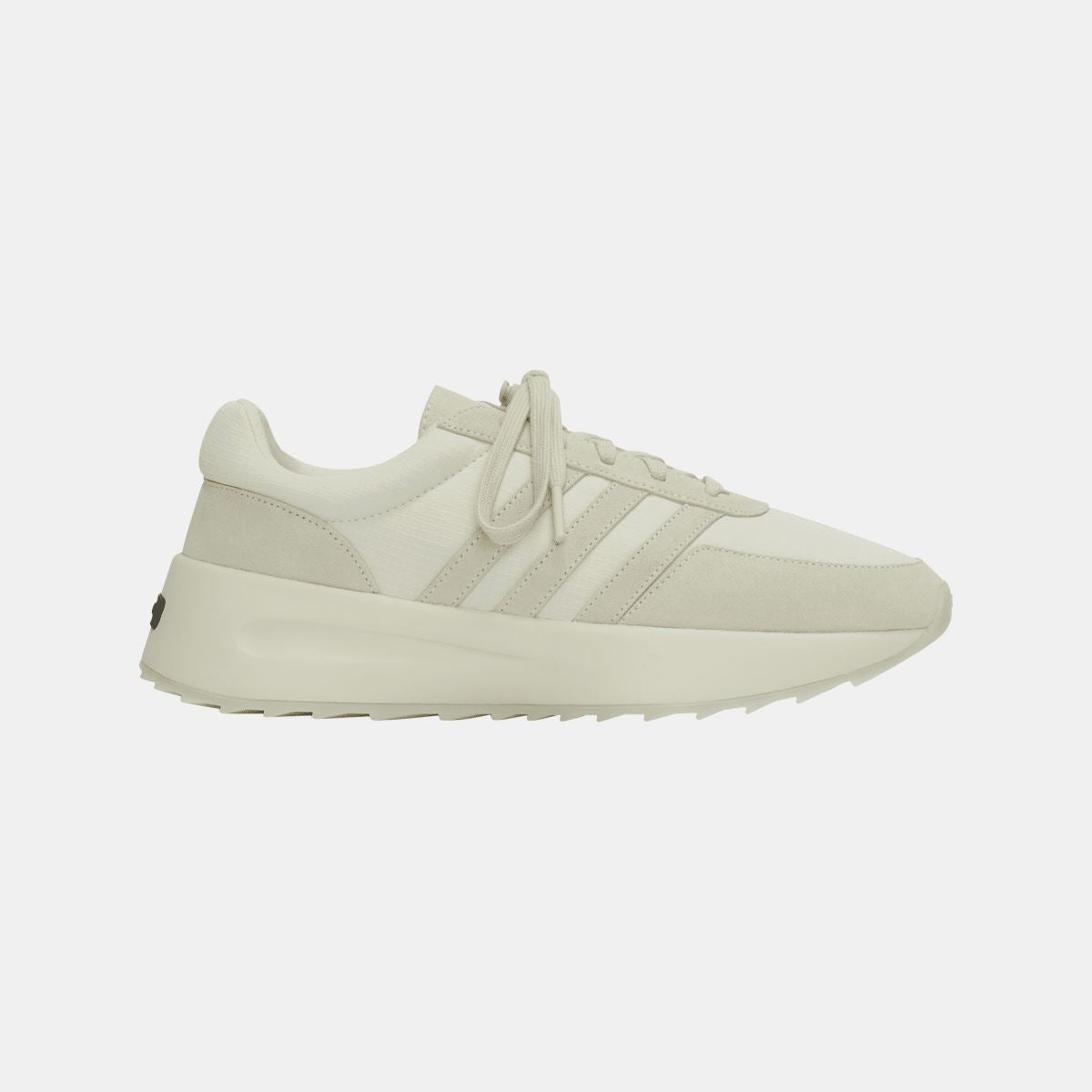 Cream low-top trainers with lace-up closure and thick midsole