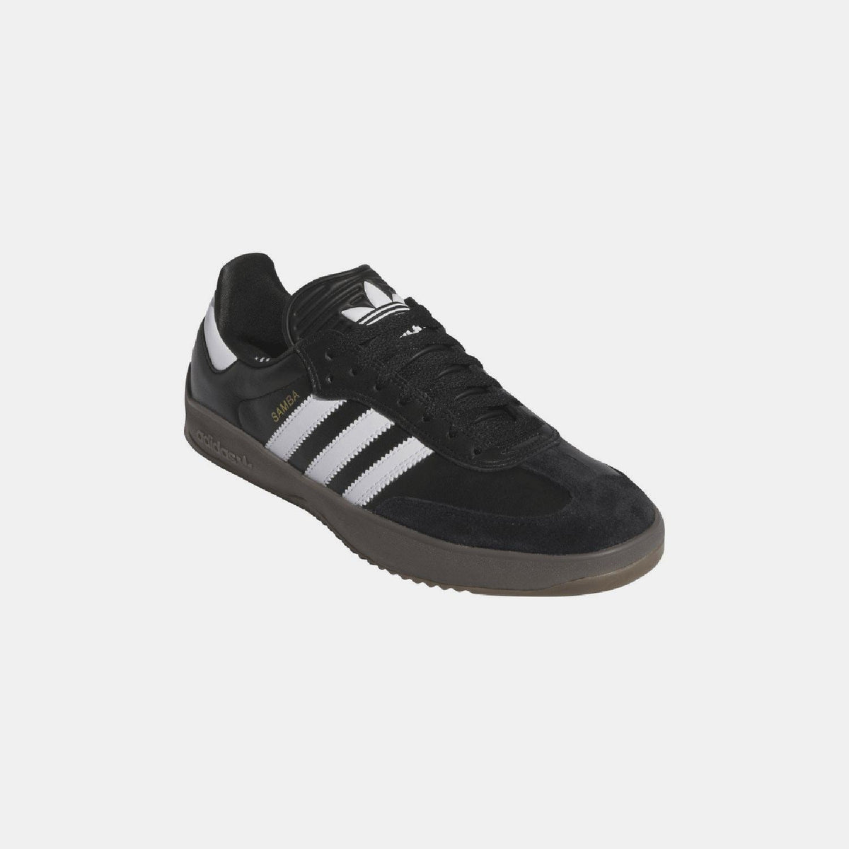 Black suede-look trainers with white adidas-style stripes and gum sole