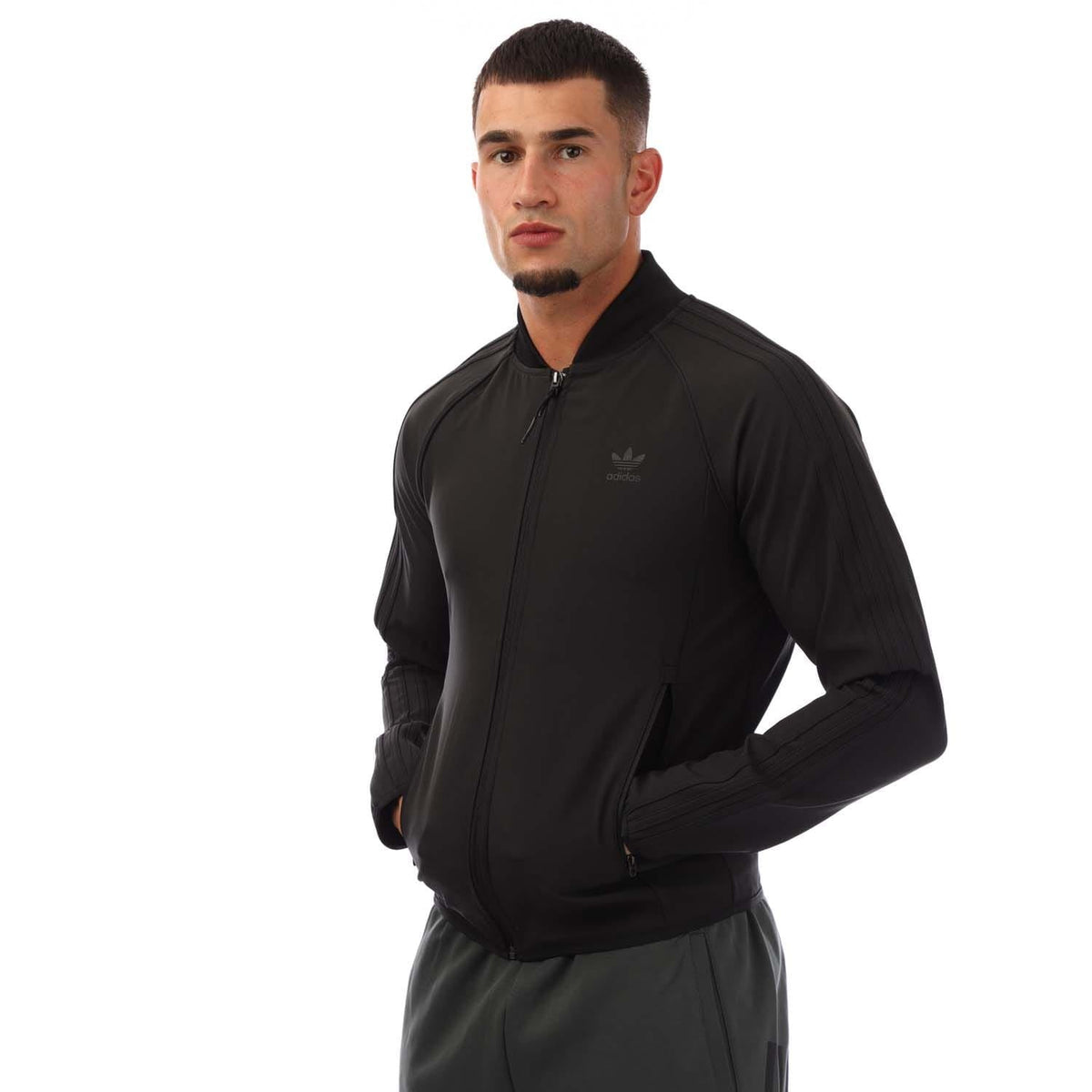adidas Originals SST Bonded Track Top in black with white stripes, featuring a zip-up front and athletic fit, perfect for sports or casual wear.