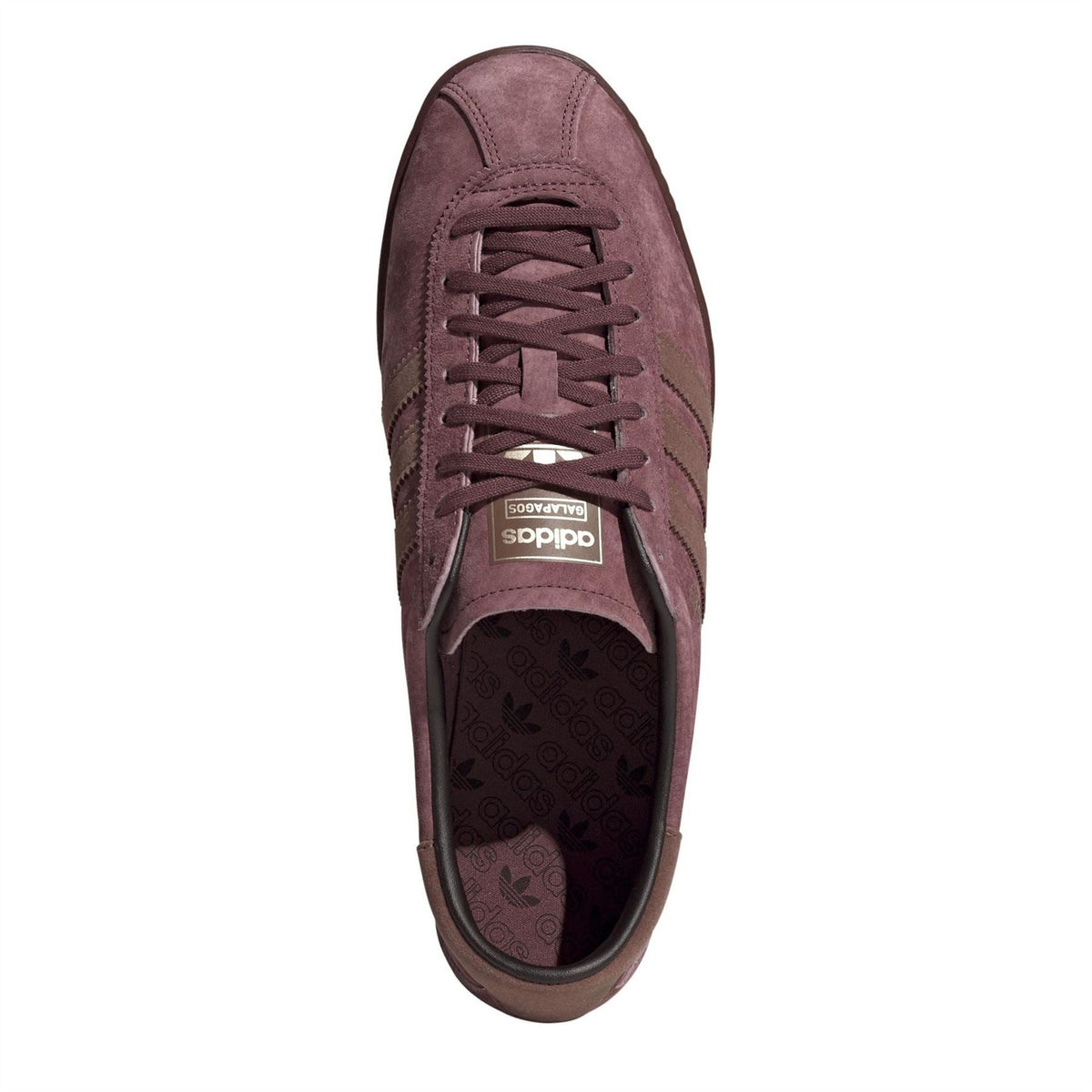 Burgundy suede lace-up sneakers with stitched toe and visible branded insole