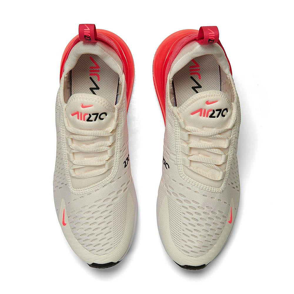 Women's Nike Air Max 270 sneakers, top view of sail knit uppers with hot pink laces.
