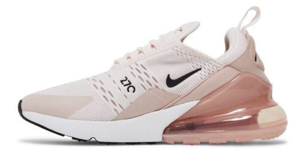 Women's Nike Air Max 270 sneakers with light pink mesh, black swoosh, and translucent pink air unit