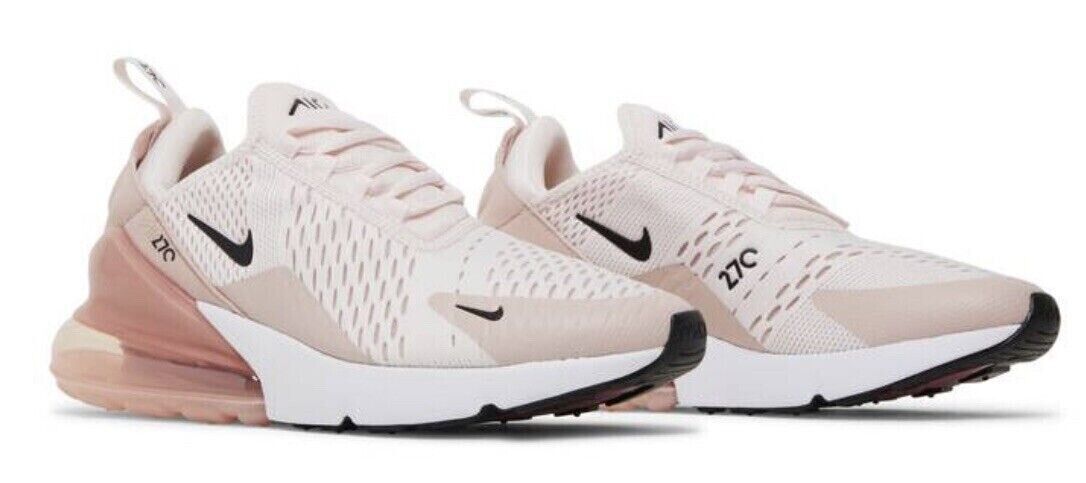 Pair of Nike Air Max 270 sneakers in light pink knit with black swooshes and visible air sole
